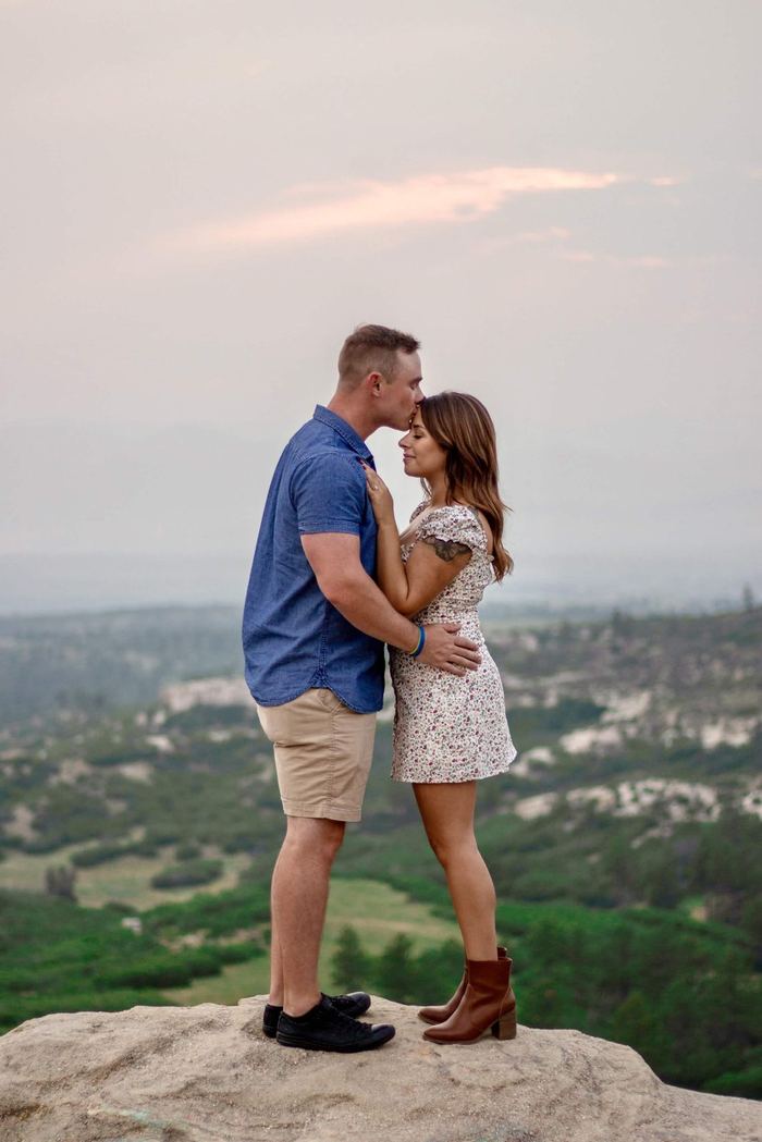 Kiss on a rocky overlook above Castle Rock after an outfit change
