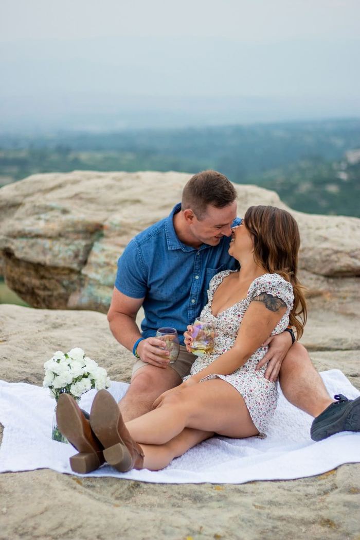 Picnic blanket and flowers on the rocks overlooking Castle Rock