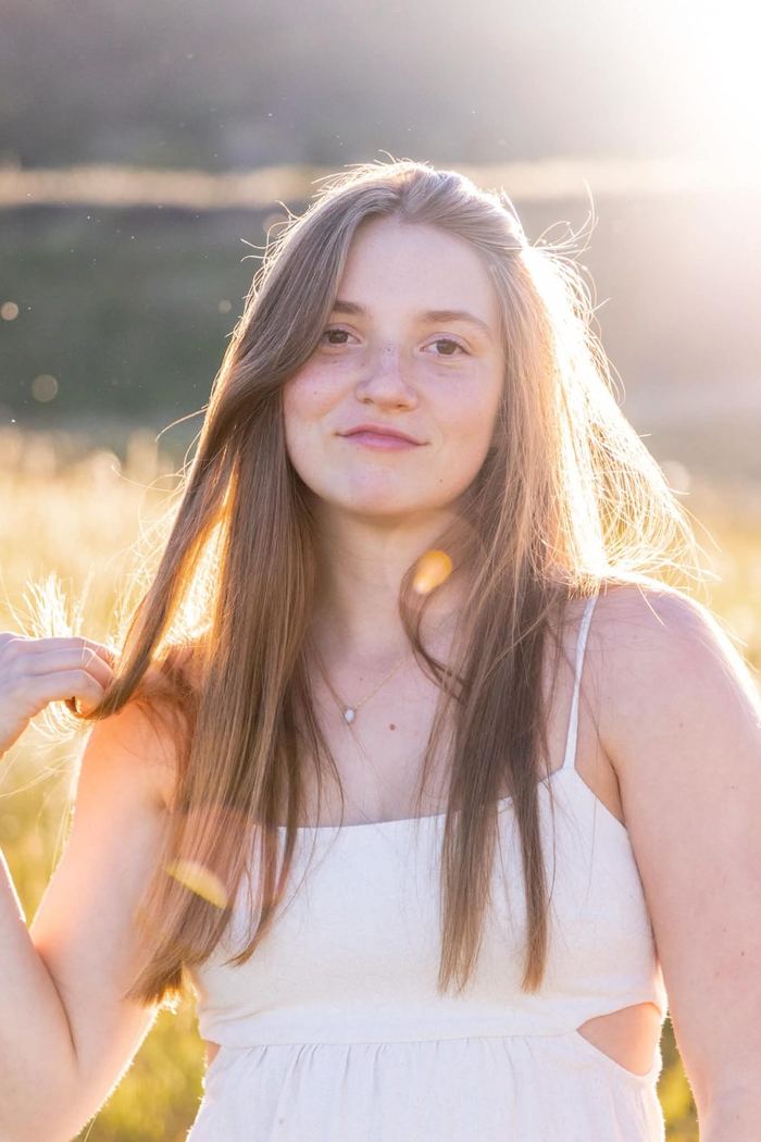 Backlit golden hour senior portrait at Elk Meadow