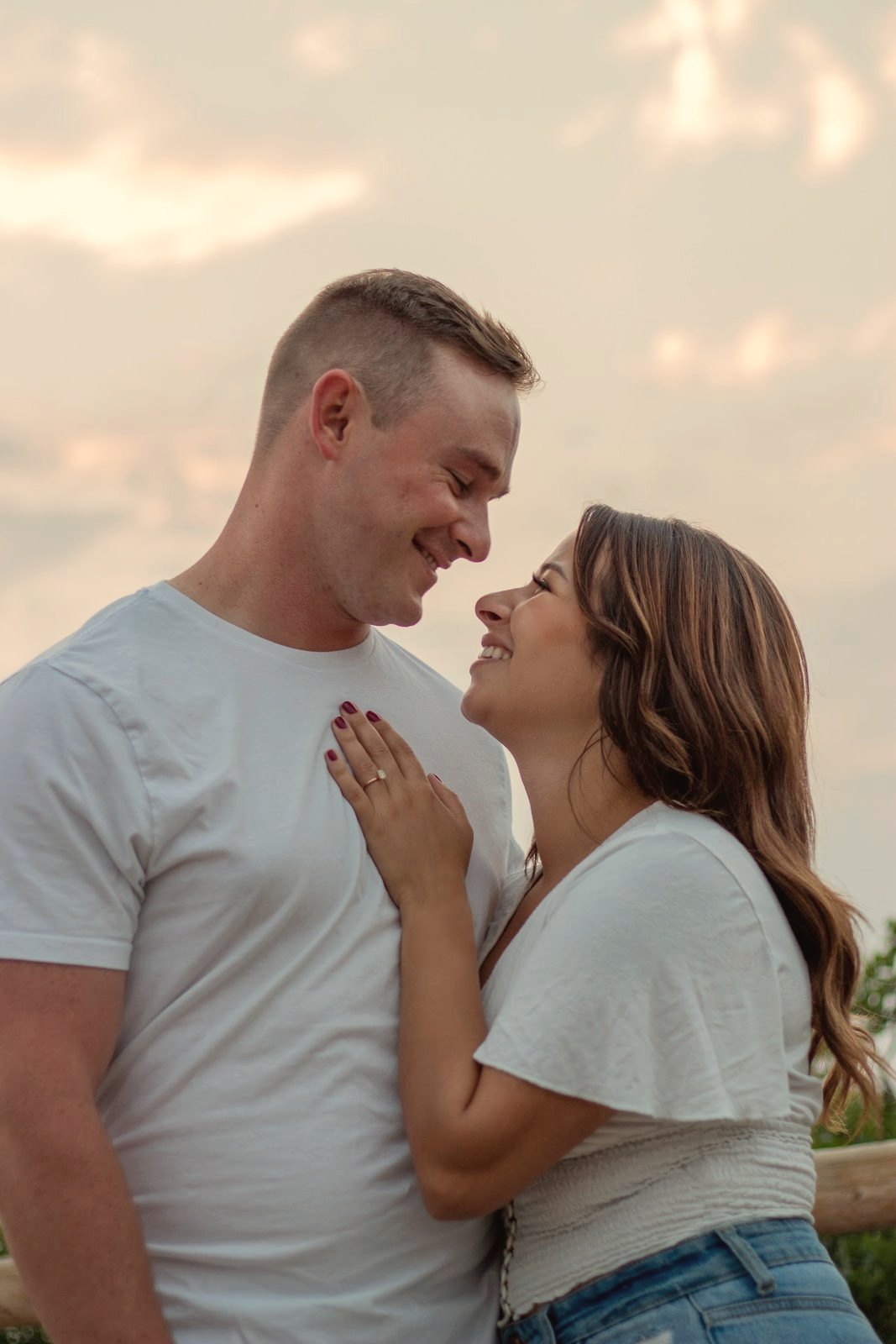 Couple close together at sunset