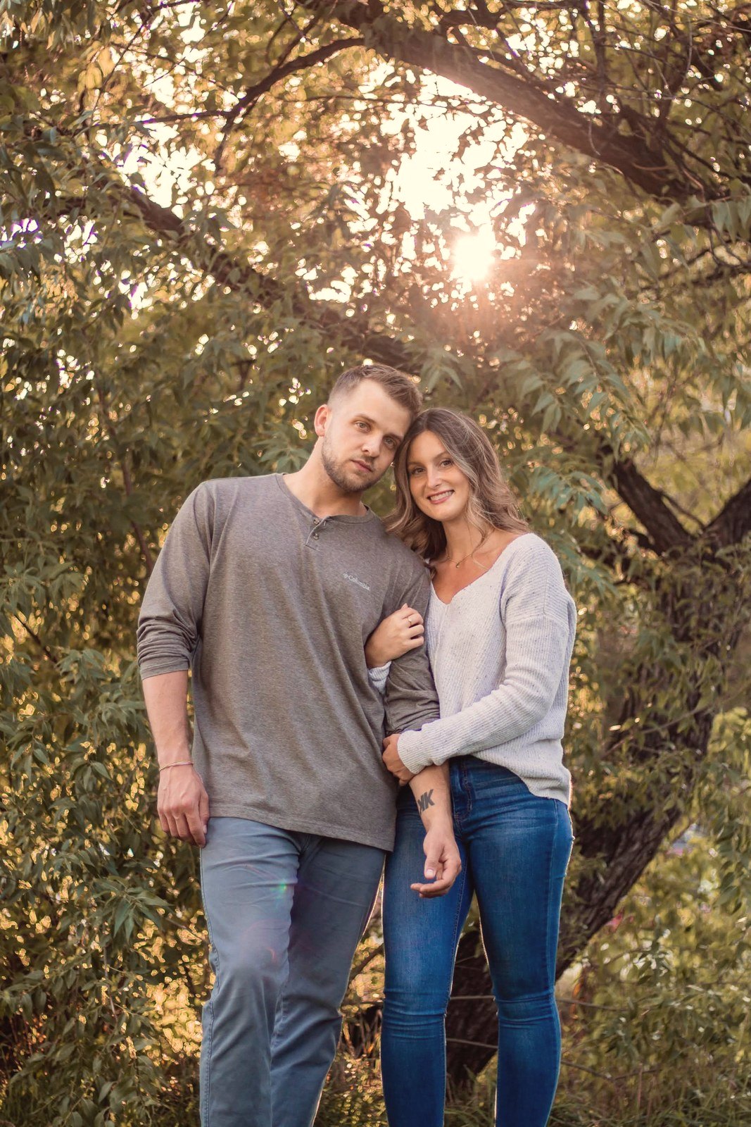 Couple at golden hour under a tree