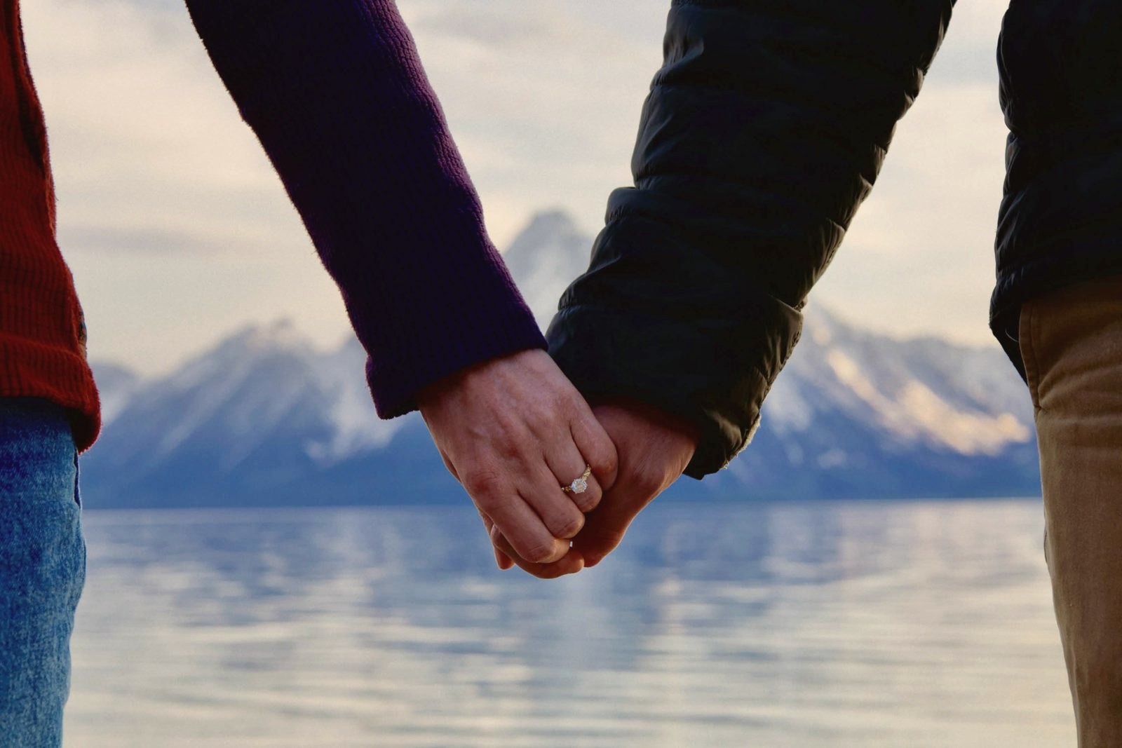 Engagement ring at a mountain lake