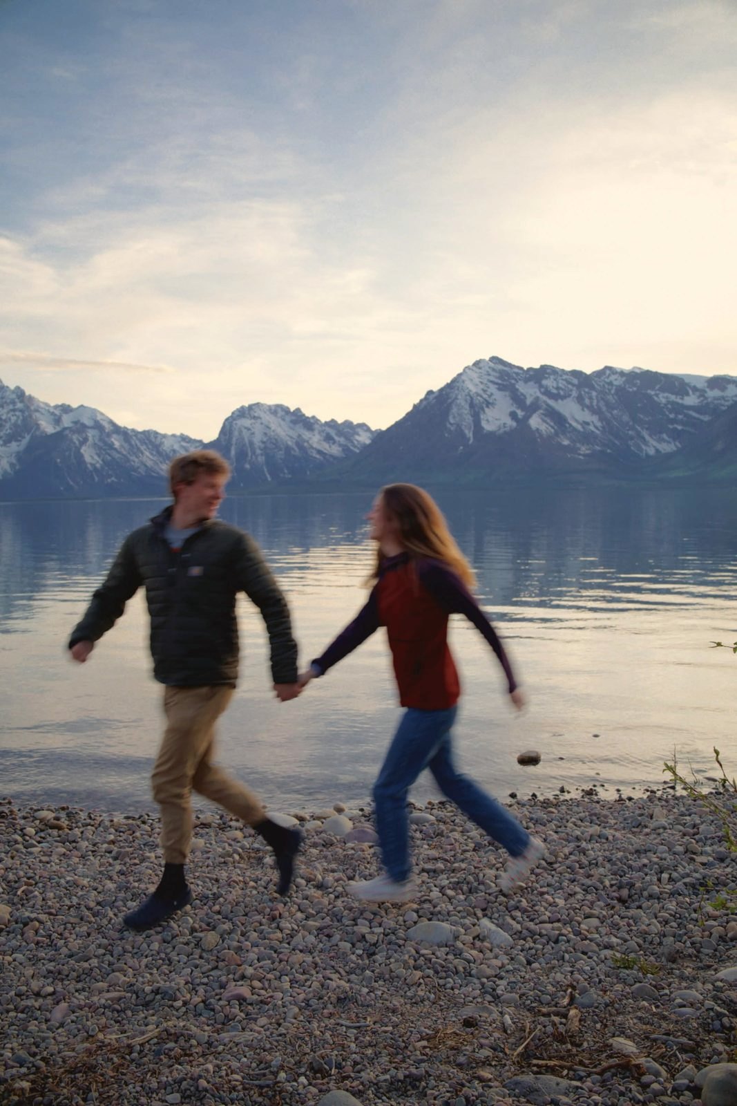 Couple walking at a mountain lake