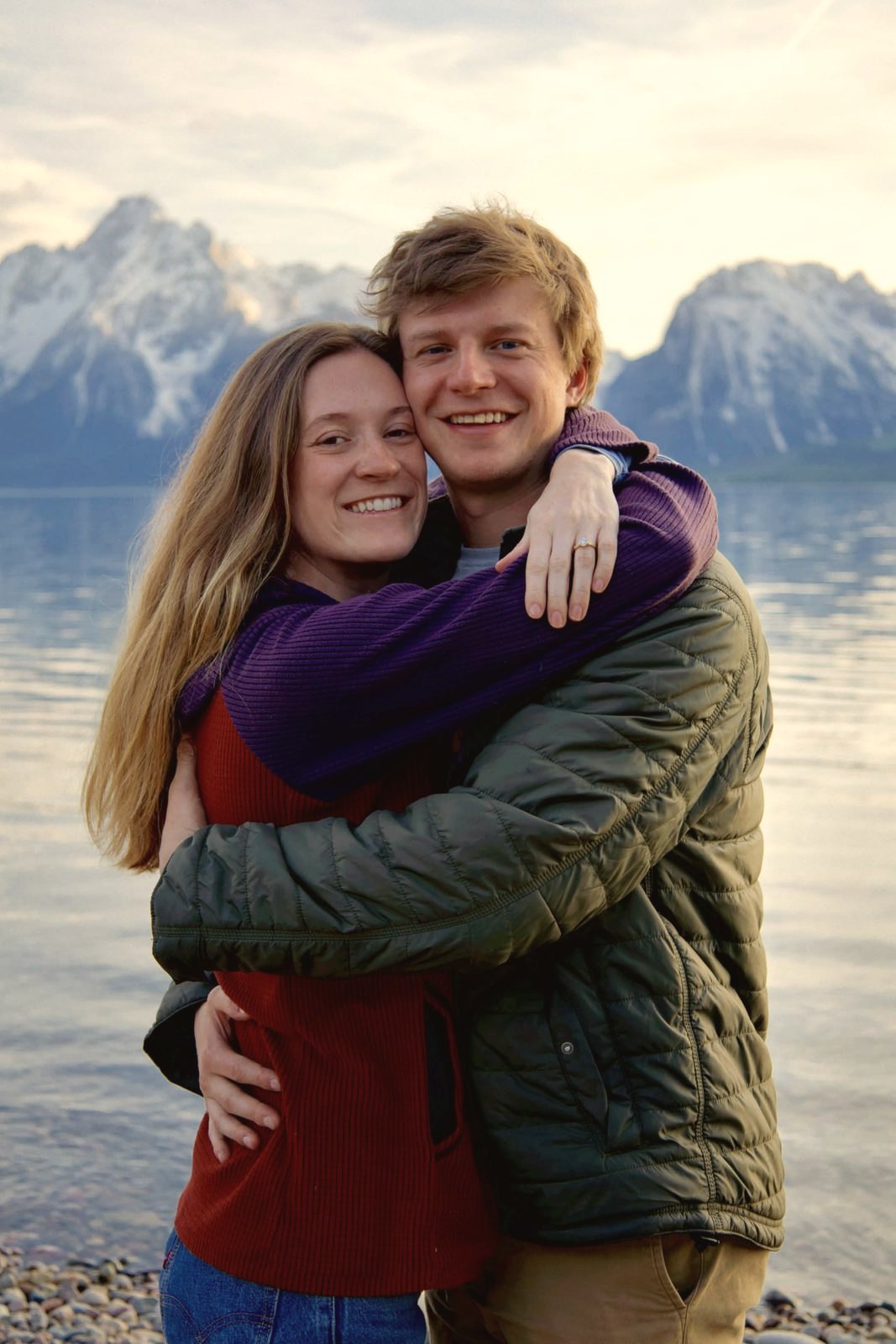 Couple embracing at a mountain lake