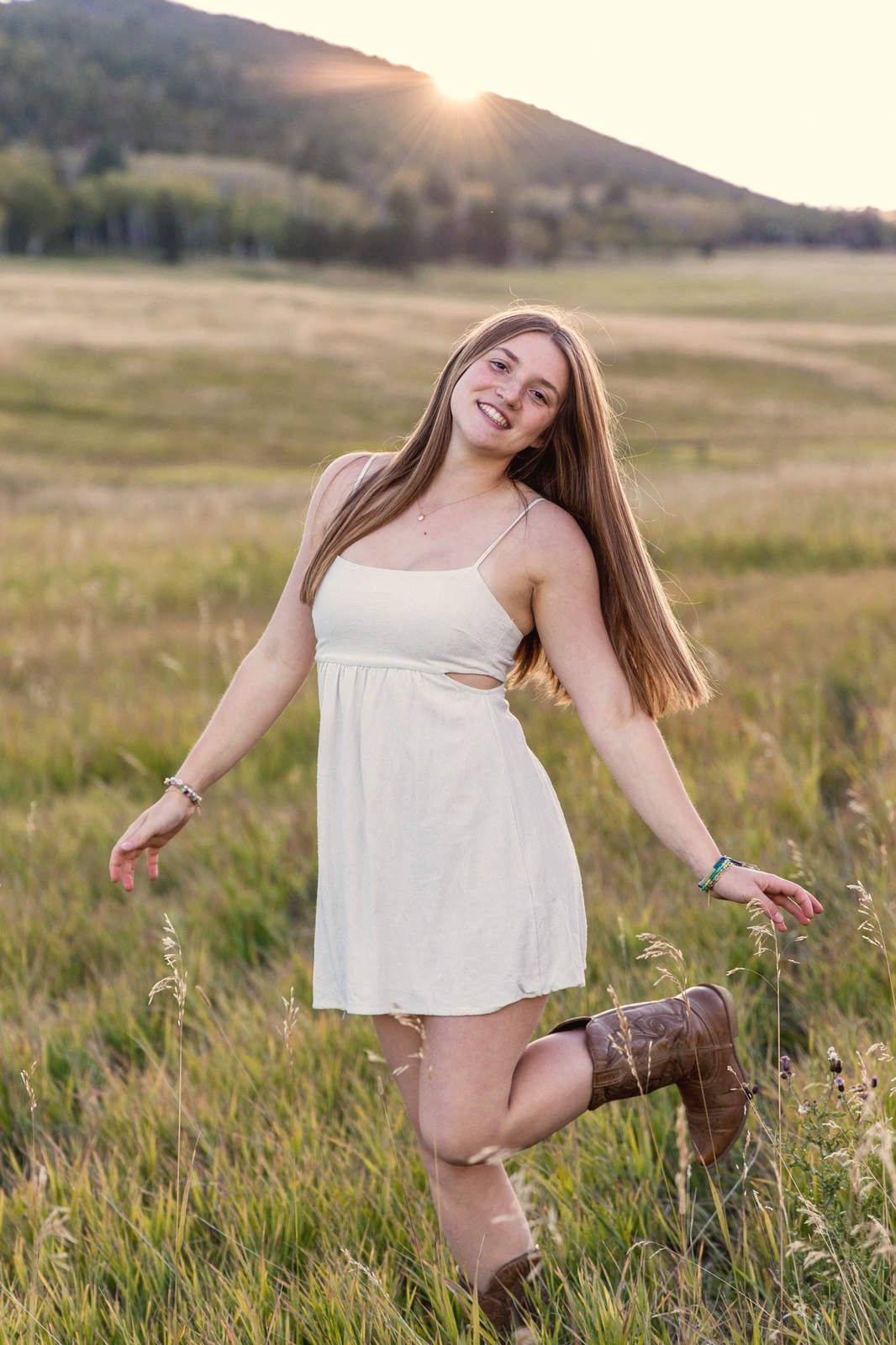 Senior portrait in a golden Colorado field