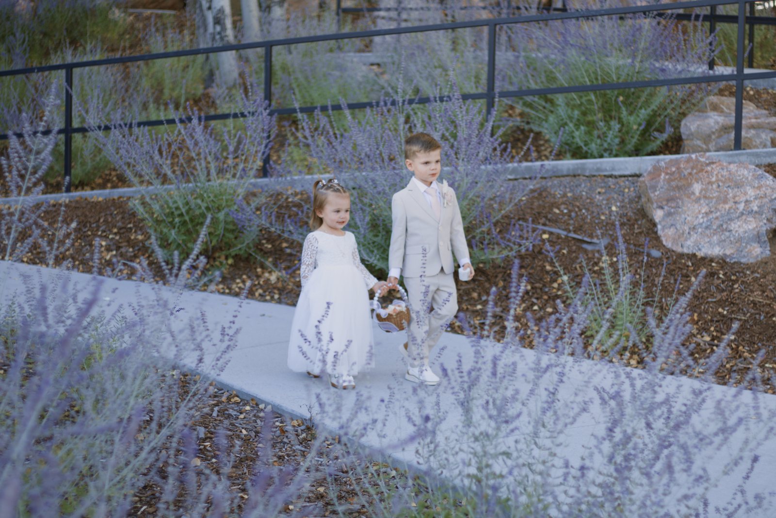 Flower girl and ring bearer walking the aisle