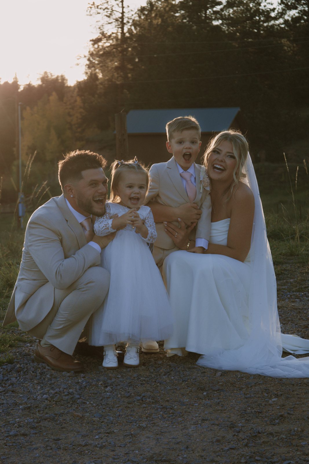 Bride and groom with their two kids