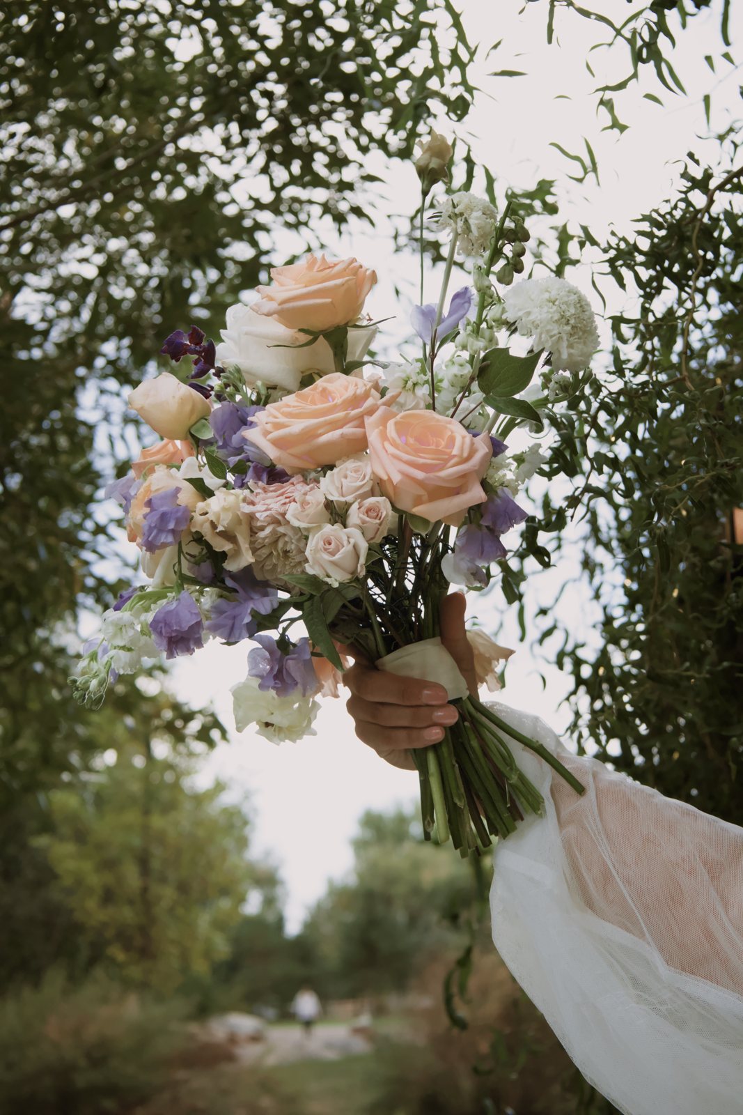 Bride's hand holding her bouquet